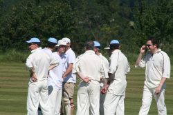 Tourists celebrate a wicket