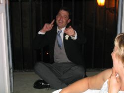 Pete cross-legged in his mourning suit