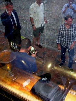 Looking down on the busker is...