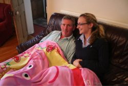 Dutton, Claire, a blanket, on the sofa...