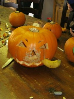 Posh pumpkin smokes a pipe