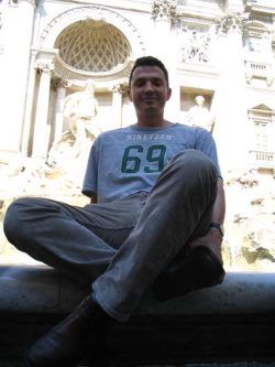 Pete cross-legged... at the Trevi Fountain in Rome